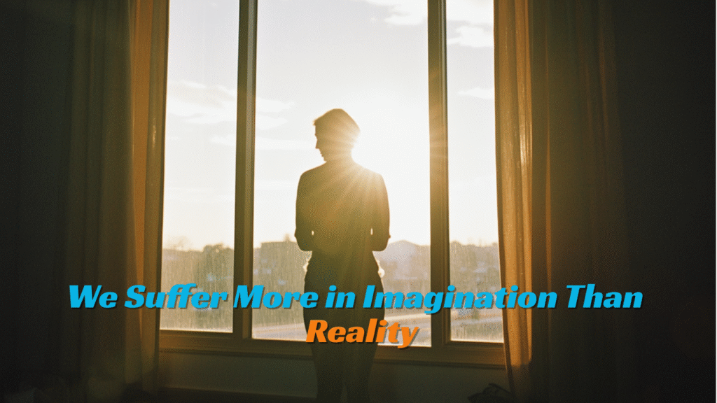 A woman standing by the window with sun rays entering the room